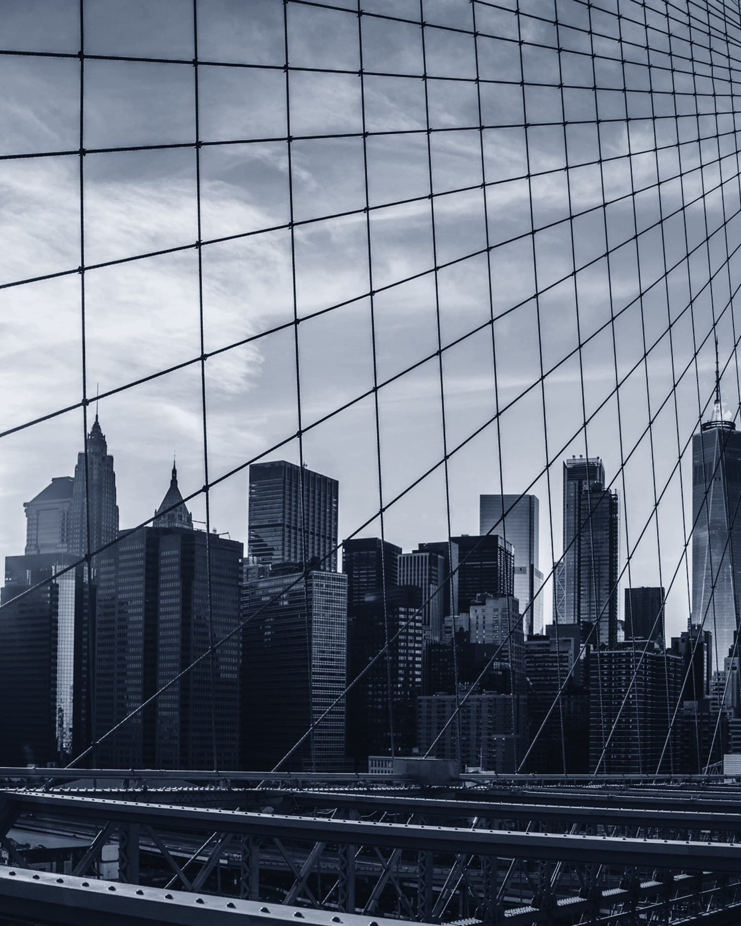 Lower Manhattan framed by the cables of the Brooklyn Bridge